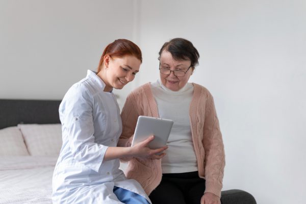 woman-holding-tablet-medium-shot